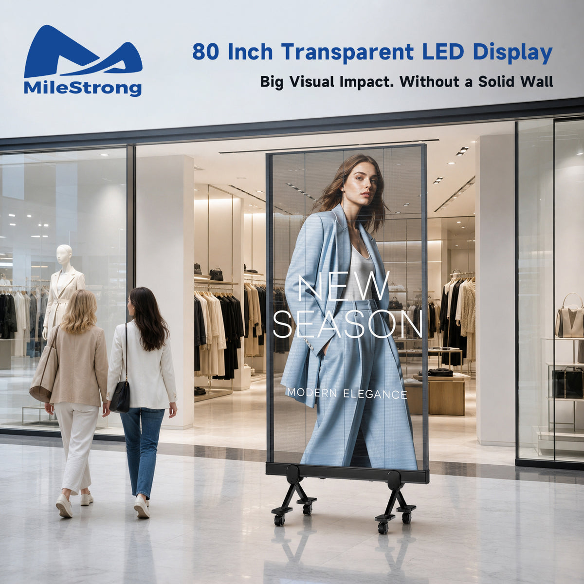An outdoor storefront scene with two women walking past a large freestanding transparent LED display on a wheeled stand. The display shows a fashion model in a light blue coat with the text 'NEW SEASON' and 'MODERN ELEGANCE.